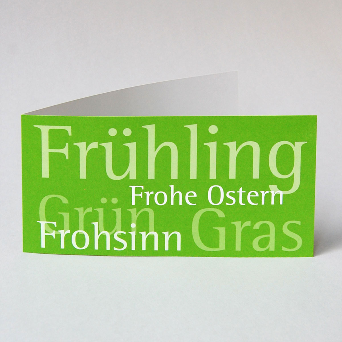 Frühling - Frohsinn - Frohe Ostern, typographische Osterkarte in grün