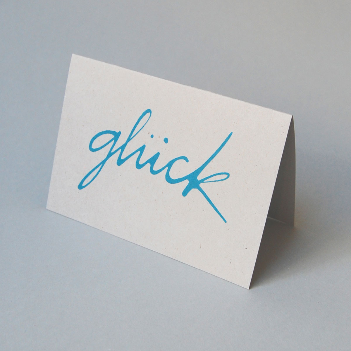 glück, Recycling-Glückwunschkarten mit türkisen schwungvollem Schriftzug