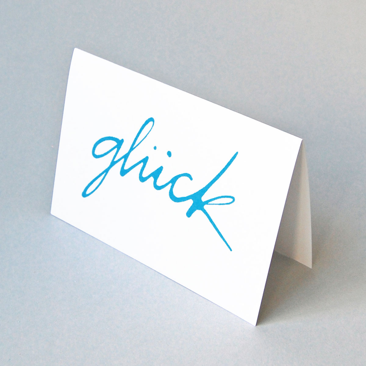 glück, blau-weiße Glückwunschkarten mit schwungvollem Schriftzug