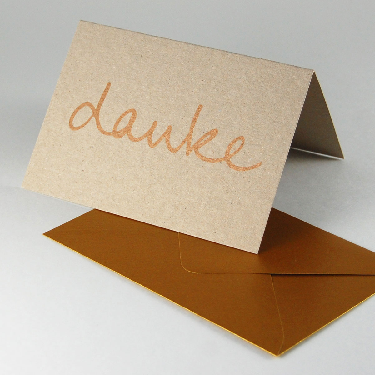 graue Karten zum Dankesagen mit goldenen Umschlägen