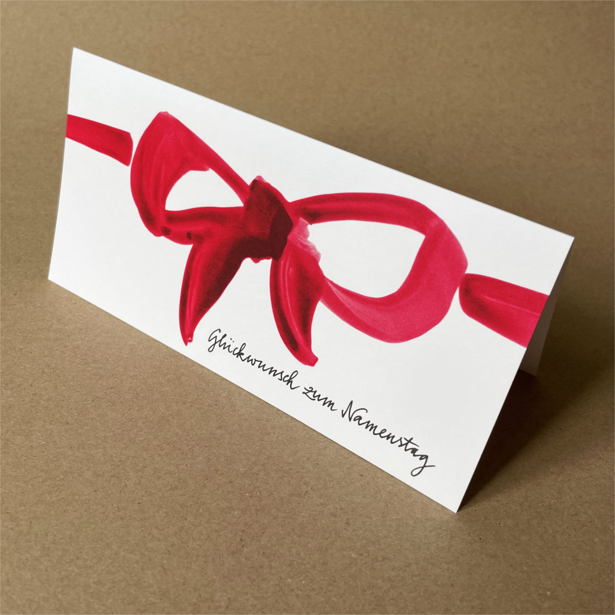 rote Schleife + Schriftzug Gl&uuml;ckwunsch zum Namenstag, Klappkarten