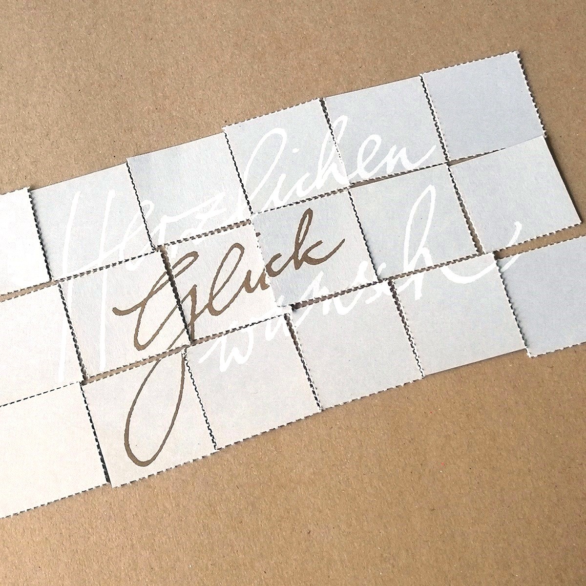 Herzlichen Glückwunsch, kalligrafierte Glückwünschkarten mit Puzzle