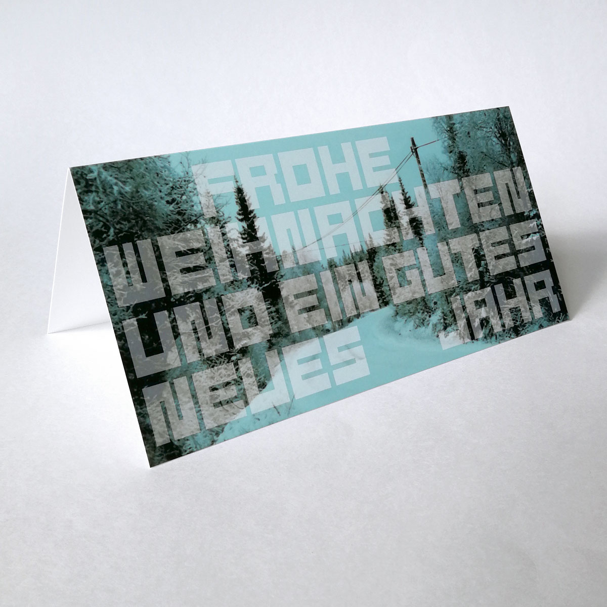 Frohe Weihnachten und ein gutes neues Jahr, Weihnachtskarten mit Spruch und Foto eines Weges im Wald mit Oberleitung