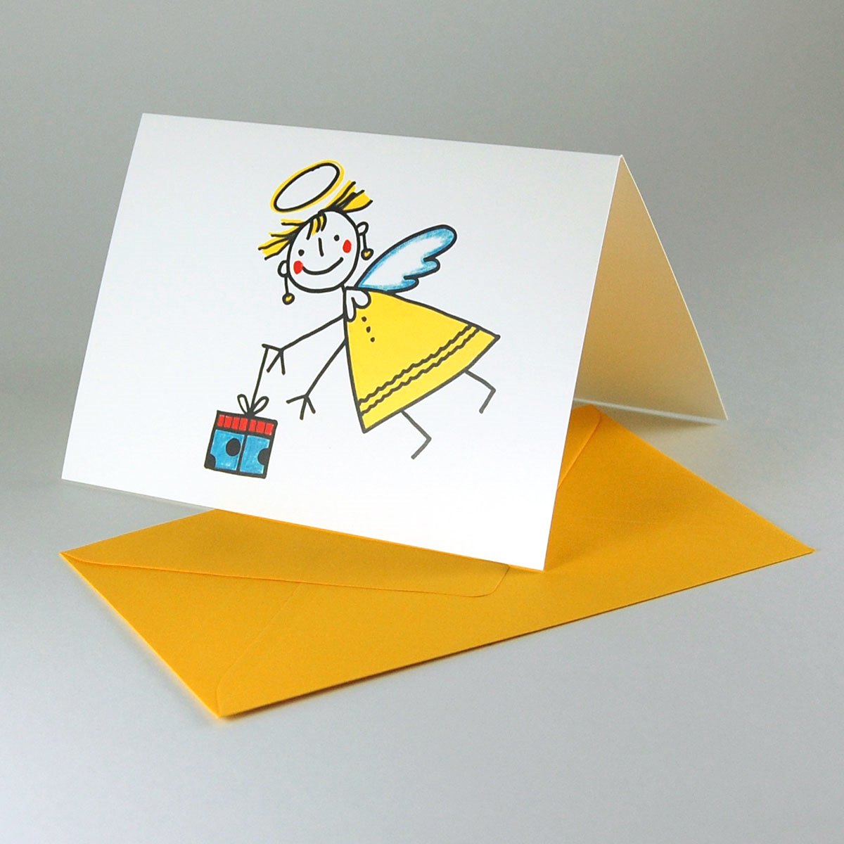 Christkind mit Geschenk, witzige Weihnachtskarten mit gelben Umschlägen