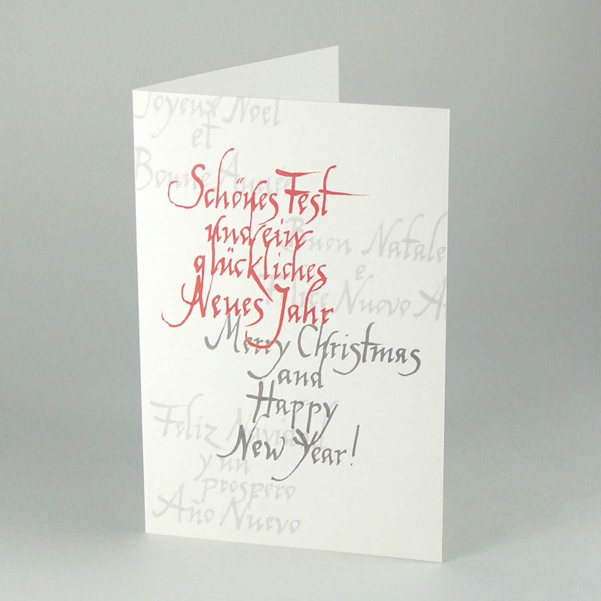 Schönes Fest, Merry Christmas kalligrafische Weihnachtskarte in fünf Sprachen aus Recycling-Karton