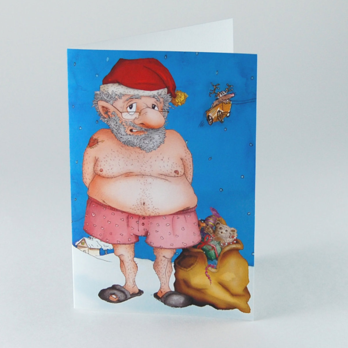 Ausgezogen - tätowierter Weihnachtsmann in Boxershorts mit löchrigen Pantoffeln, witzige Weihnachtskarten