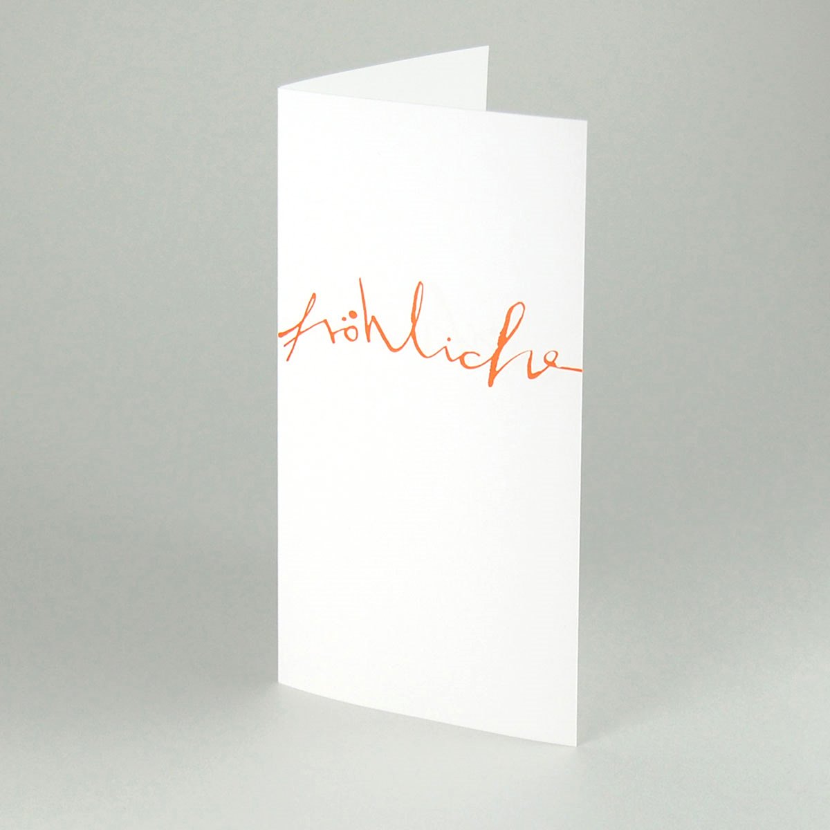 ausgefallene Weihnachtskarten mit orangem Schriftzug: fröhliche