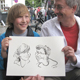 Portraitkarikaturen bei einem Berliner Straßenfest