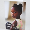 Mädchen mit Mappe, Weihnachtskarten für einen guten Zweck
